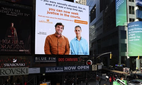 A Safe Horizon public service announcement about the Adult Survivors Act plays in Times Square on Nov. 18, 2022, in New York. 