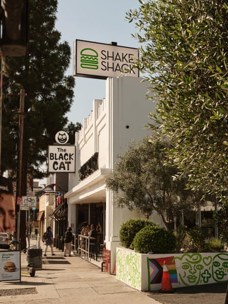 Shake Shack towers over the Black Cat Tavern, a historic LGBTQ+ Silver Lake institution.