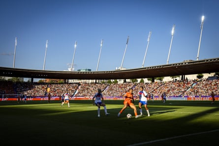 England defenders keep an eye on Chasity Grant on a sunny evening in Zurich.