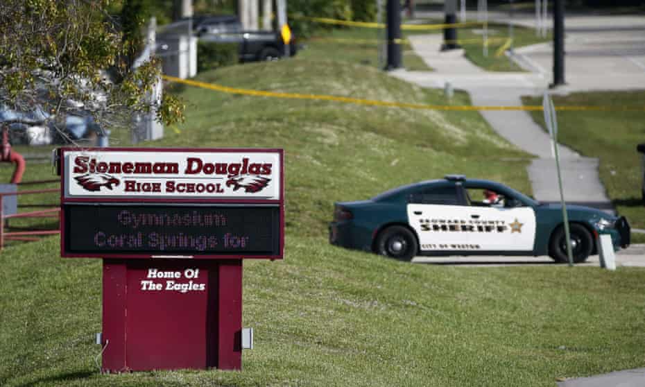 Law enforcement officers block off the entrance to Marjory Stoneman Douglas High School on 15 February 2018 in Parkland, Florida.