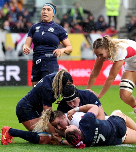 Kelsey Clifford of England scores her team's first try against Scotland.