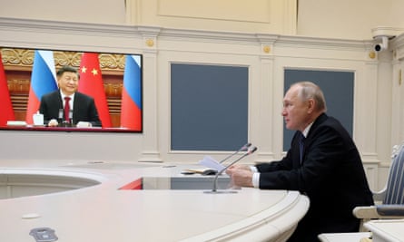 Vladimir Putin holds talks with China’s President Xi Jinping via a video link from Moscow, Russia, 30 December 2022.