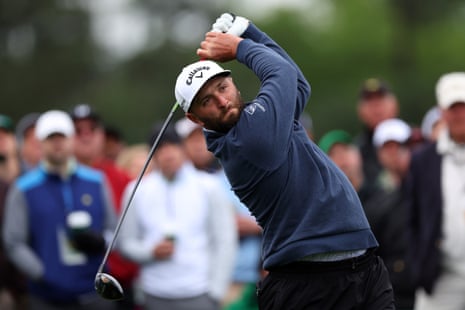 Jon Rahm plays his shot from the 8th tee.