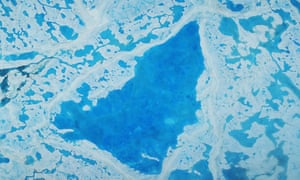A large pool of melt water over sea ice in the Beaufort Sea in July. 