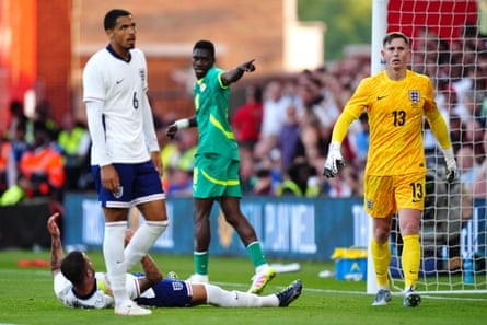 Ismaïla Sarr celebrates his equaliser as England players look forlorn.