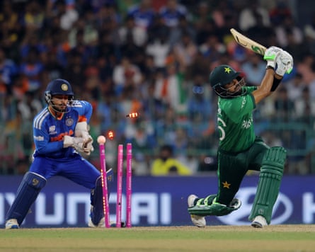 Pakistan’s Babar Azam (right) is bowled by Axar Patel for five