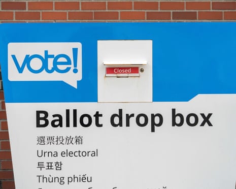 A King County ballot drop box stands outside a library in Washington