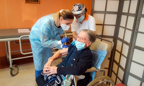 A 108-year-old care home resident in Milan is given her Covid jab.