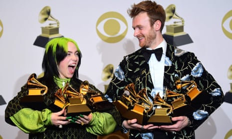 Billie Eilish and her brother Finneas O’Connell pose with Grammy awards on Sunday. 