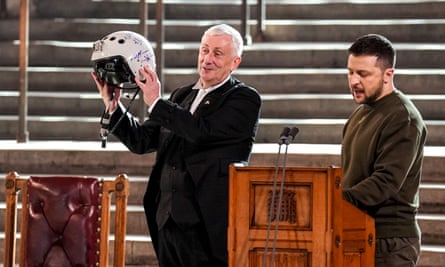 Speaker Sir Lindsay Hoyle holds the helmet of a Ukrainian pilot inscribed with the words: “We have freedom, give us wings to protect it”, presented to him by President Volodymyr Zelenskiy.