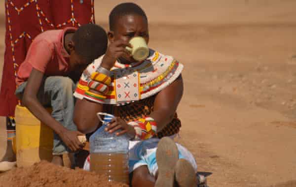 Kareni Lematile drinks water dug up from the river bed