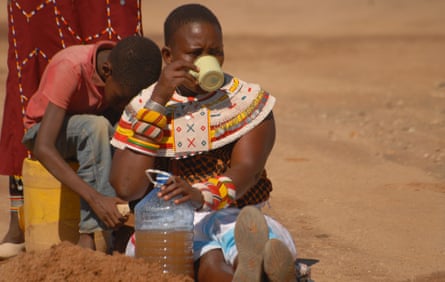 Kareni Lematile drinks the water dug up from the riverbed