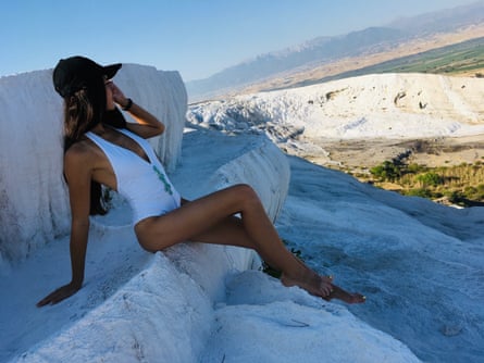 Margarita Reutt in a white swimsuit.