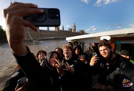Taking selfies in front of the Houses of Parliament.