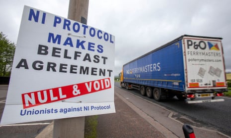 A lorry passes a sign condemning the Northern Ireland protocol