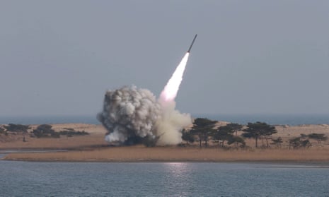 North Korea launches a projectile in this undated photograph made available on Friday by the North Korean news agency KCNA.