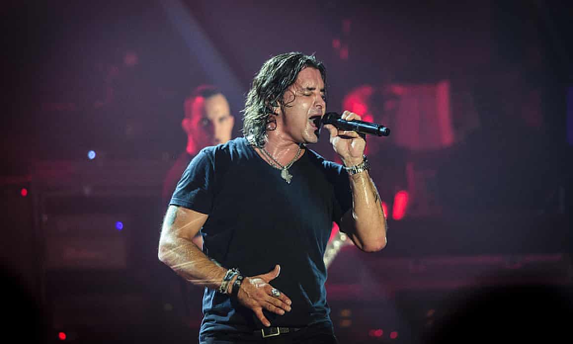 Scott Stapp, the frontman of the American band Breed, sings into a microphone on stage at the Danforth Music Hall in Toronto.