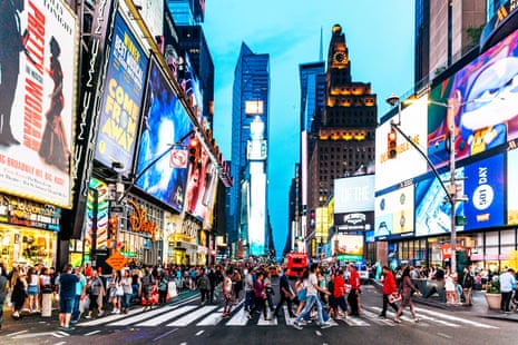 Crowds of people walking at Times Squares in New York.
