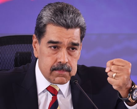 Nicolás Maduro raising a fist