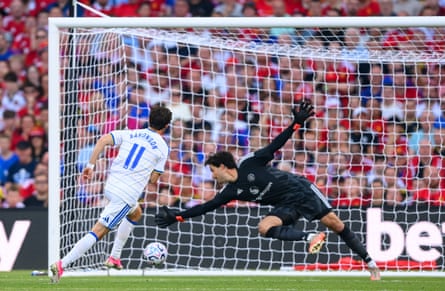Brenden Aaronson shots past a diving Senne Lammens to score Leeds’s equaliser against Manchester United.
