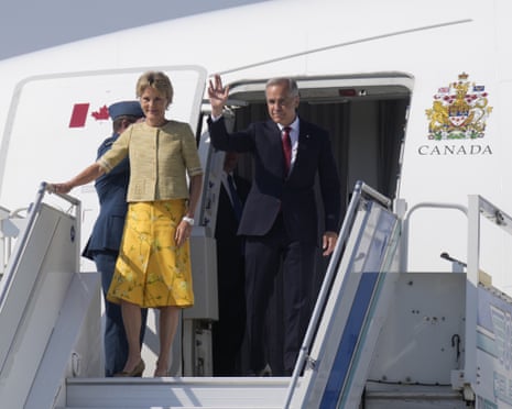 Canadian prime minister Mark Carney and Diana Fox Carney disembark a government plane in Ankara, Turkey.