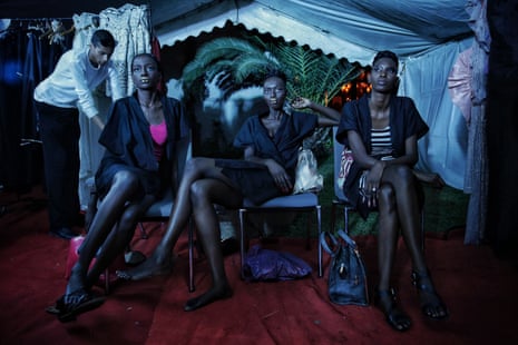 Models sit backstage during Dakar fashion week in June 2017