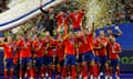 Spain celebrate with the European Championship trophy after beating England in Berlin.