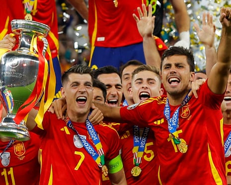 Ălvaro Morata, left, and Rodri with the Euro 2024 trophy. 