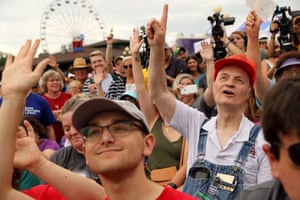 Audience members raise their hands to question Democratic presidential candidate Tom Steyer as he speaks at the Des Moines Register Political Soapbox at the Iowa State Fair in Des Moines, Iowa.