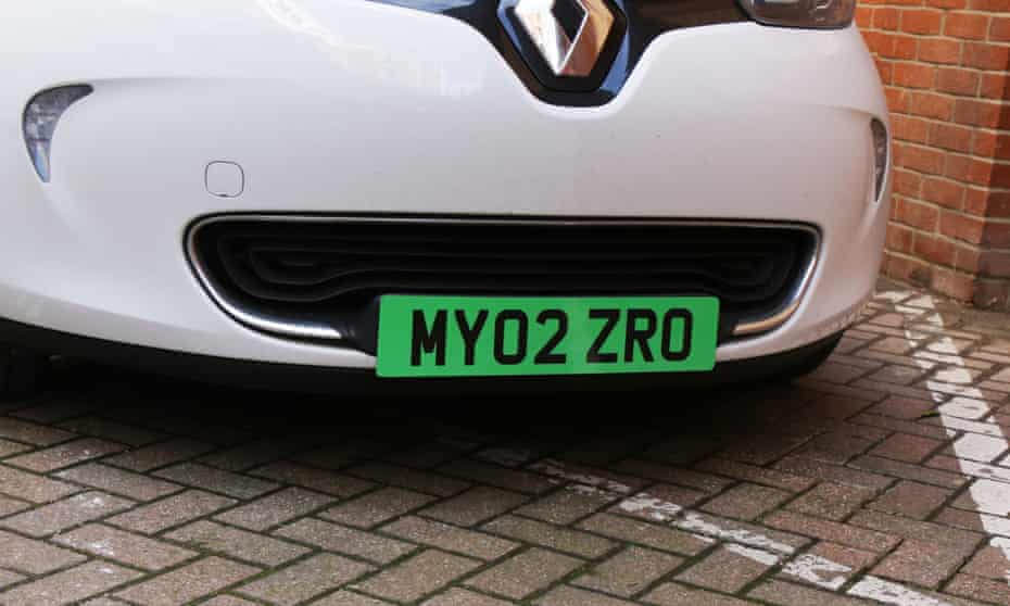 An electric car with a green number plate.