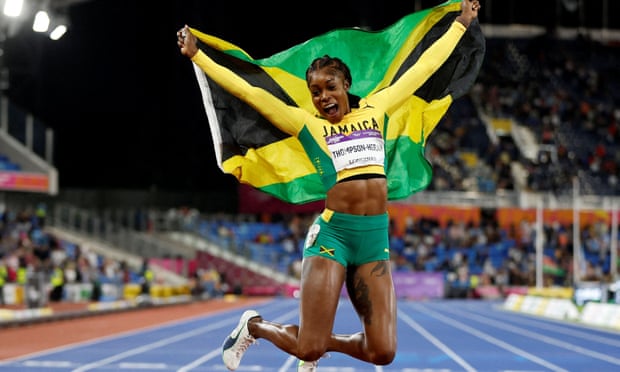 Elaine Thompson-Herah jumps for joy after winning 100m gold