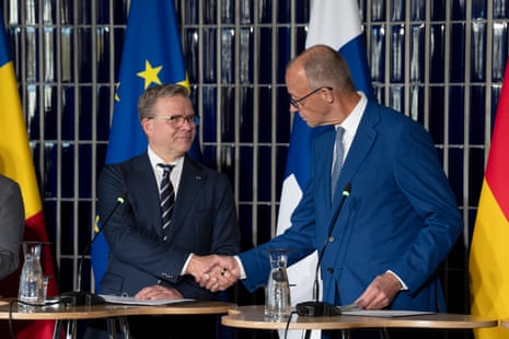 Finnish Prime Minister Petteri Orpo (L) and German Chancellor Friedrich Merz (R) attend the European Arctic Summit in Rovaniemi, Finland, 14 September 2026.