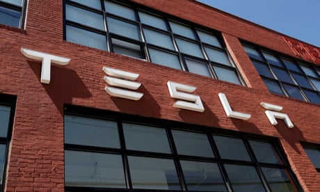 FILE PHOTO: The TESLA logo is seen outside a dealership in the Brooklyn borough of New York City, U.S., April 26, 2021. REUTERS/Shannon Stapleton/File Photo