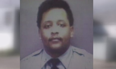 Police officer looks at camera