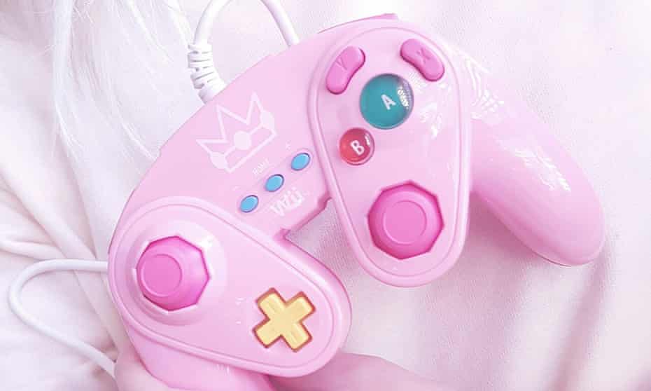 A pink Nintendo Gamecube controller. 
