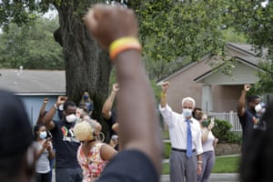 US representative Charlie Crist, second from right, stands in solidarity with guests during a Juneteenth 2020 celebration outside the Dr Carter G. Woodson African American Museum Friday in St. Petersburg, Florida.
