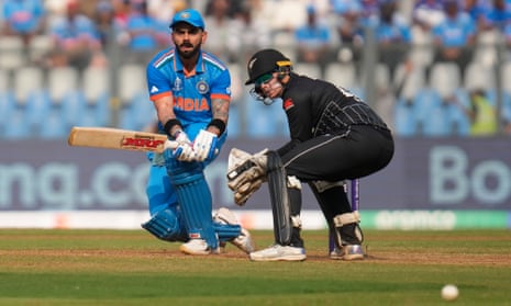 Virat Kohli sticks his tongue out as he plays the shot.