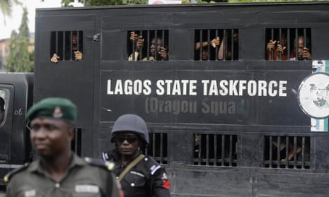 Police officers detain people during a protest in Lagos, Nigeria, August, 2019.
