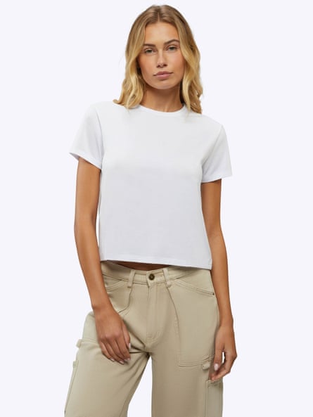 woman wearing white t-shirt and tan pants