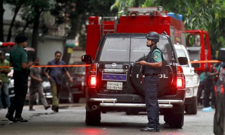 Bangladeshi security officers cordon off the area after heavily armed militants attacked the Holey Artisan cafe in Dhaka last month.