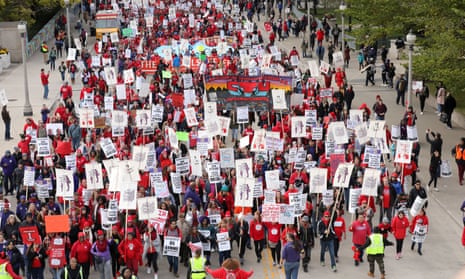 Teachers protest during a rally and march on the first day of a teacher strike in Chicago, Illinois, on 17 October.
