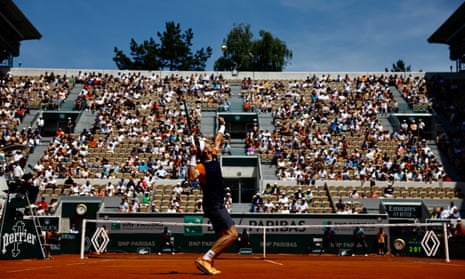 Casper Ruud serves to Elias Ymer during their first round match at the 2023 French Open.