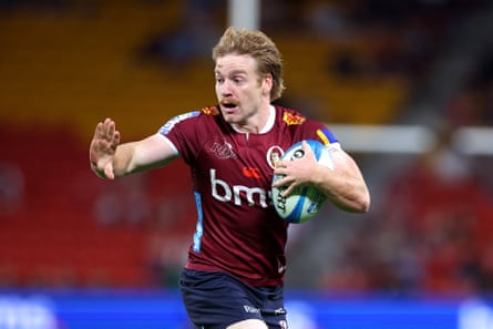 Harry McLaughlin-Phillips of the Reds fends while running with the ball