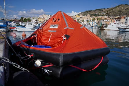 An inflatable emergency lifeboat sits in Porticello harbour
