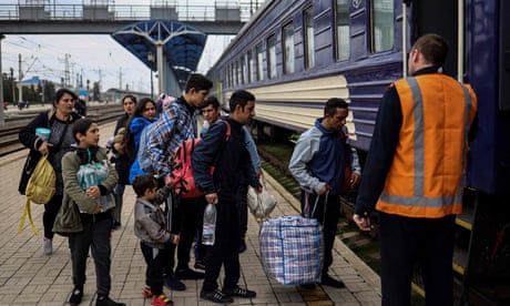 People board an evacuation train at Slovyansk central station ahead of an expected Russian offensive in eastern Ukraine