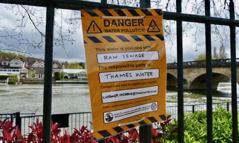 An official-looking warning poster put up by a campaign group, yellow with a heading saying 'Danger'. The text underneath reads in part as follows: "This river is polluted by: raw sewage. The responsible party is: Thames Water"
