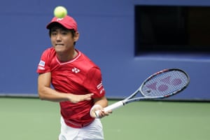 Yoshihito Nishioka returns a shot to Andy Murray.