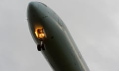 A plane lowers its undercarriage as it descends for landing at London Heathrow airport. Photograph: Avpics/Alamy