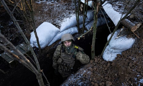 A Ukrainian serviceman smokes a cigarette at his position on the frontline near Bakhmut.