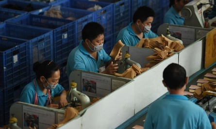 Workers at Dongguan’s Huajian shoe factory.